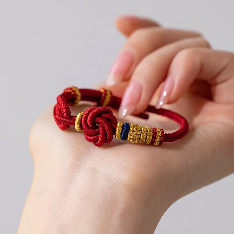 Bracelet porte-bonheur en corde avec breloque en fleur de pêcher et nœud d'amour véritable fait à la main par Buddha Stones