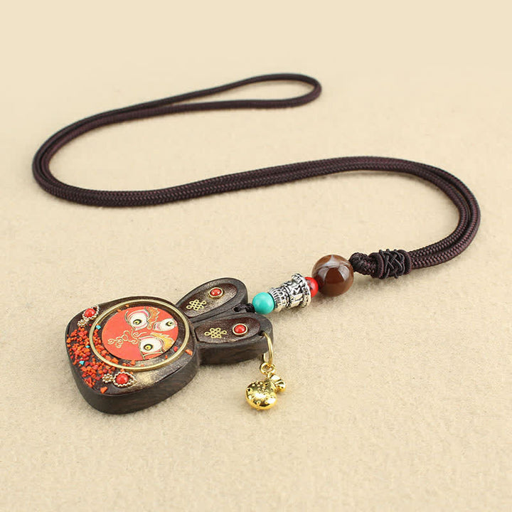 Collier pendentif Thangka en ébène du Tibet représentant les cinq dieux de la richesse