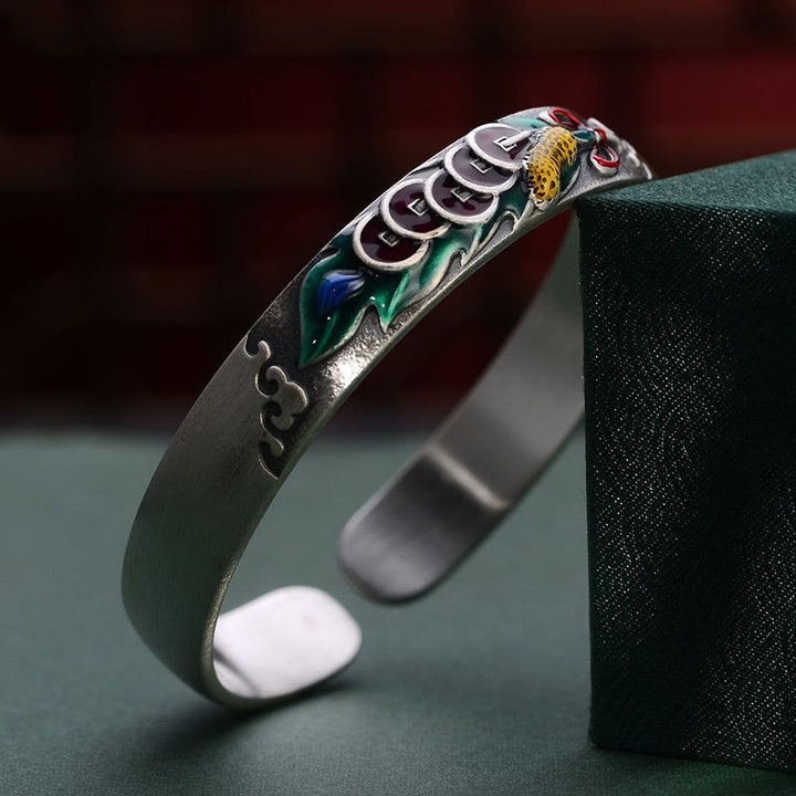 Bracelet Feng Shui en Buddha Stones avec cinq pièces de monnaie de l'empereur et cacahuètes