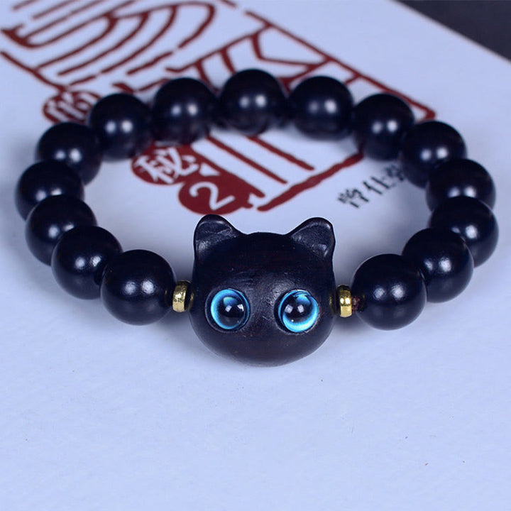 Bracelet Buddha Stones Bois d'ébène Verre Liuli Joli Chat Paix Équilibre - Perles en ébène 12 mm x 15 (tour de poignet 14-16 cm) - image 13