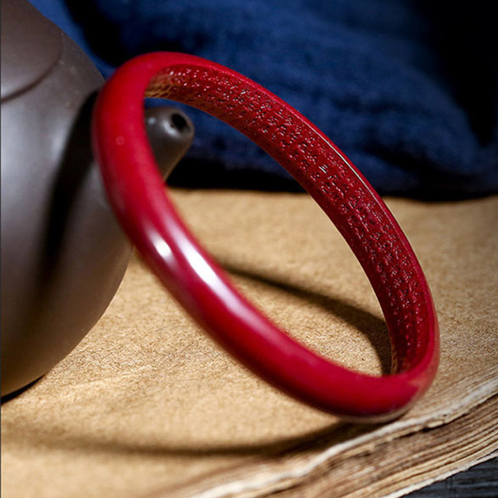 Bracelet jonc de bénédiction gravé du Sutra du cœur en Buddha Stones en cinabre