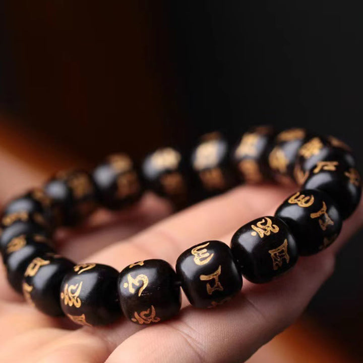 Bracelet de paix gravé en bois d'ébène tibétain avec Buddha Stones Om Mani Padme Hum