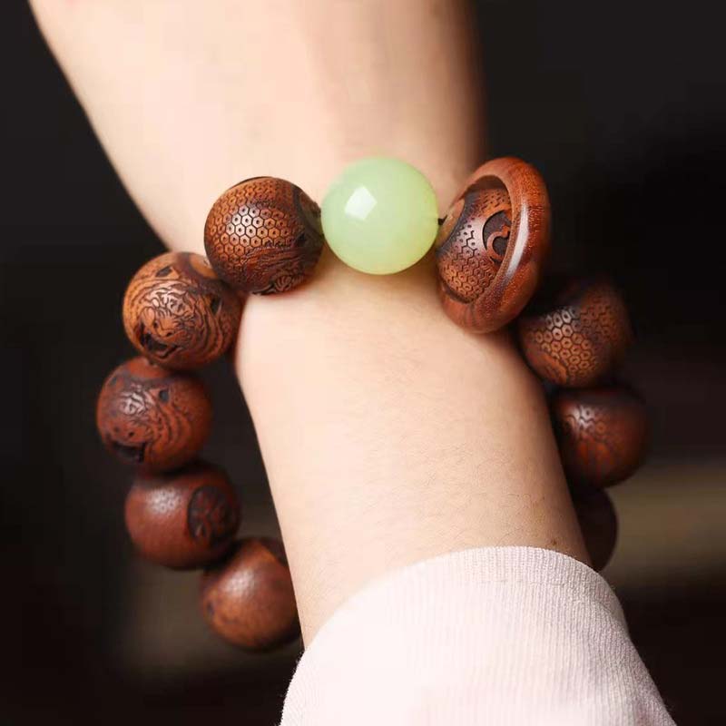 Bracelet de protection du tigre gravé en bois de rose tibétain Buddha Stones