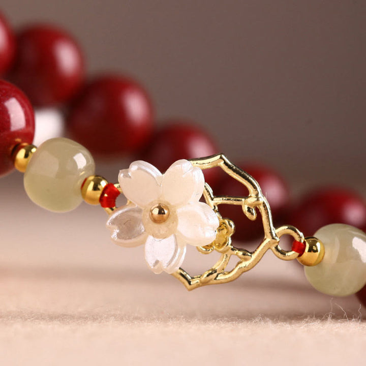 Bracelet de bénédiction en pierre de cinabre naturelle et jade Tridacna avec Buddha Stones