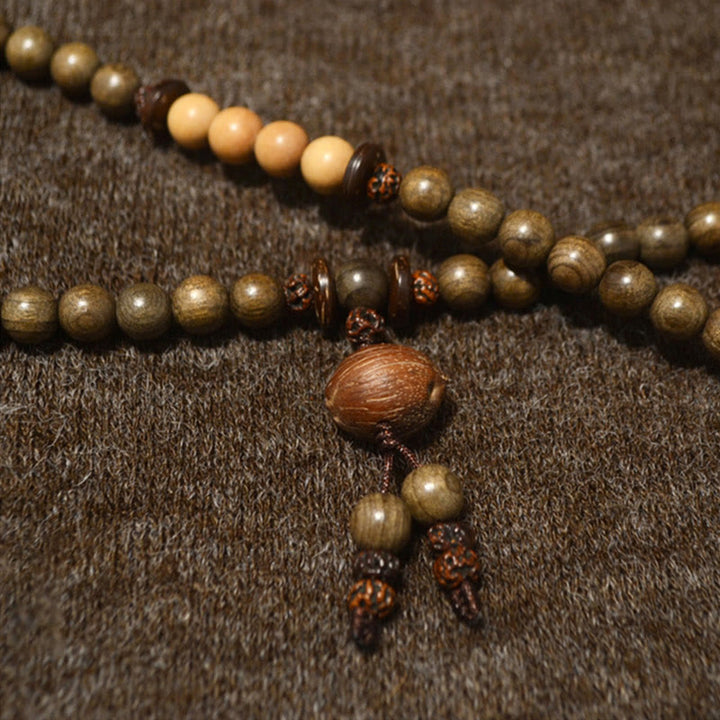 Bracelet Mala avec breloque de protection en bois de santal tibétain et Buddha Stones