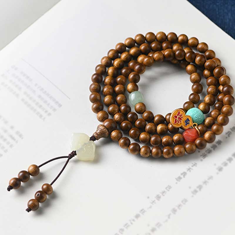 Bracelet Mala tibétain de protection et de calme en bois de rose avec Buddha Stones
