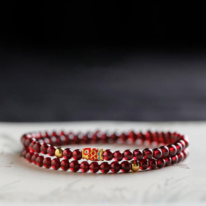 Bracelet de protection en grenat naturel avec poisson koï en or 999 de Buddha Stones - Bracelet double tour en forme de poisson koï grenat et or 4 mm - 17 cm - image 9
