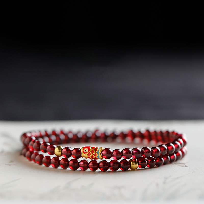 Bracelet de protection en grenat naturel avec poisson koï en or 999 de Buddha Stones - Bracelet double tour en grenat et or avec motif de carpes koï (4 mm). - 17 cm - image 8