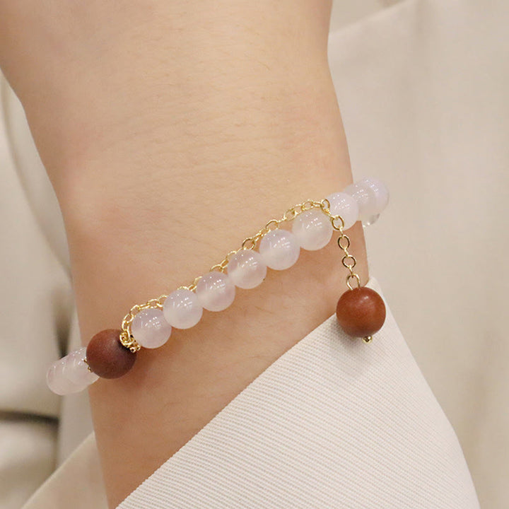 Bracelet de protection à breloques en bois de santal et œil de chat Fu avec Buddha Stones
