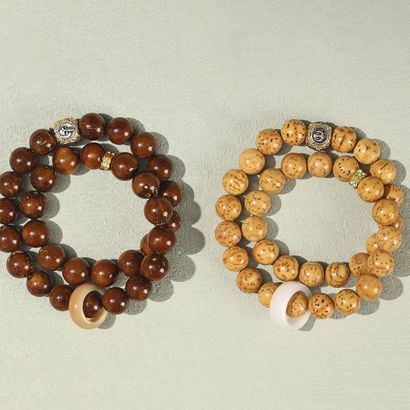 Bracelet double tour en Buddha Stones tibétaines naturelles violettes et dorées avec graines de Bodhi et de richesse