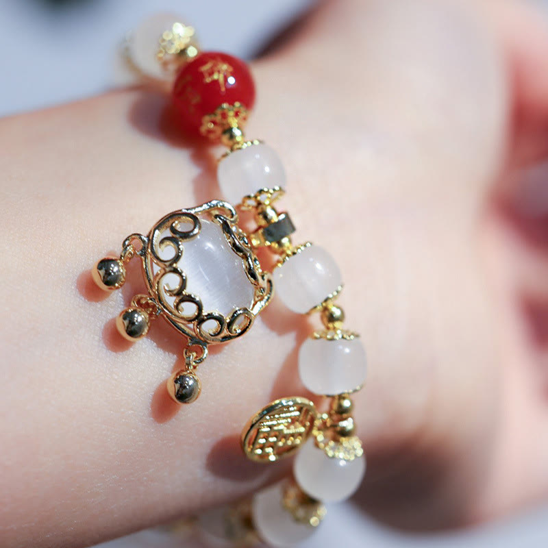 Bracelet de bénédiction avec breloque en forme de moulin à vent en Buddha Stones et caractère Fu