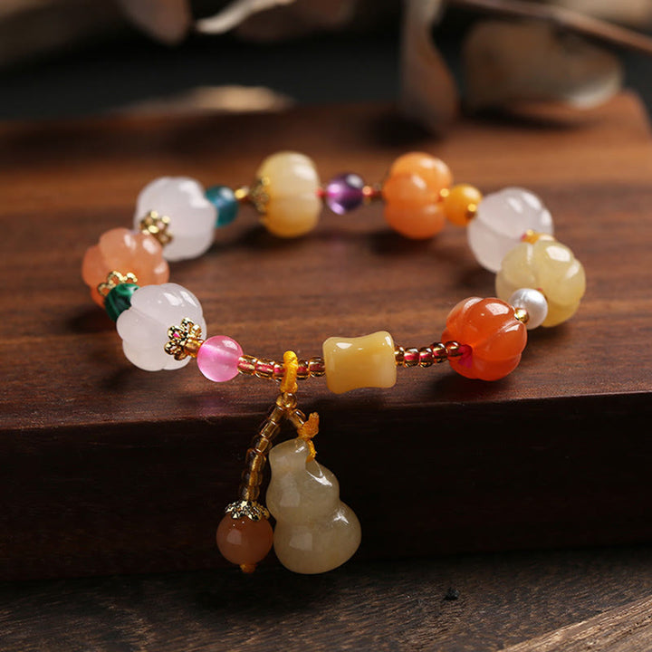 Bracelet à breloques en perles de citrouille Pixiu en soie dorée naturelle et cristaux de jade