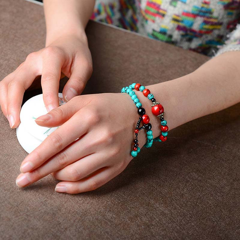 Bracelet de protection en perles de turquoise rouge et onyx noir Buddha Stones
