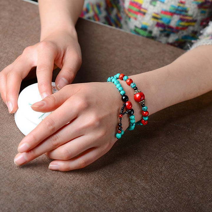 Bracelet de protection en perles de turquoise rouge et onyx noir Buddha Stones
