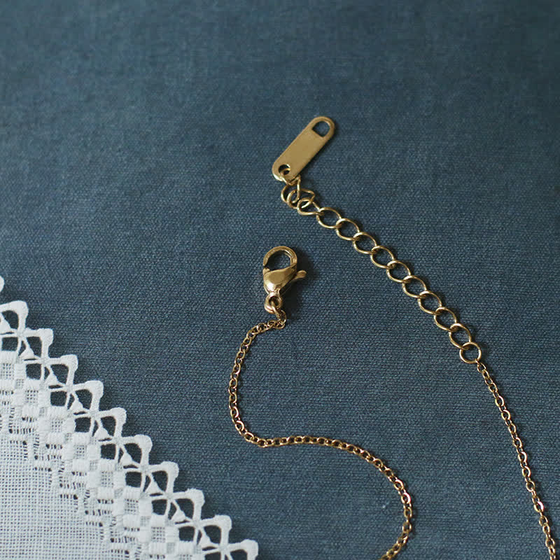 Collier porte-bonheur en acier titane avec pendentif éléphant