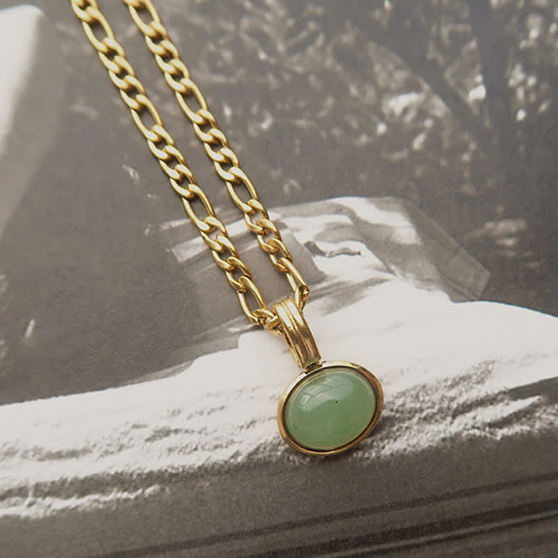 Collier pendentif ovale en acier titane et turquoise