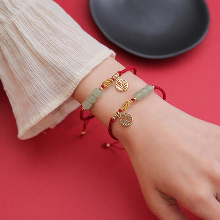 Bracelet porte-bonheur en corde rouge avec perles de jade fabriquées à la main par Buddha Stones