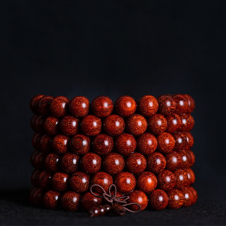 Bracelet d'équilibre tibétain en petites feuilles de santal rouge avec Buddha Stones