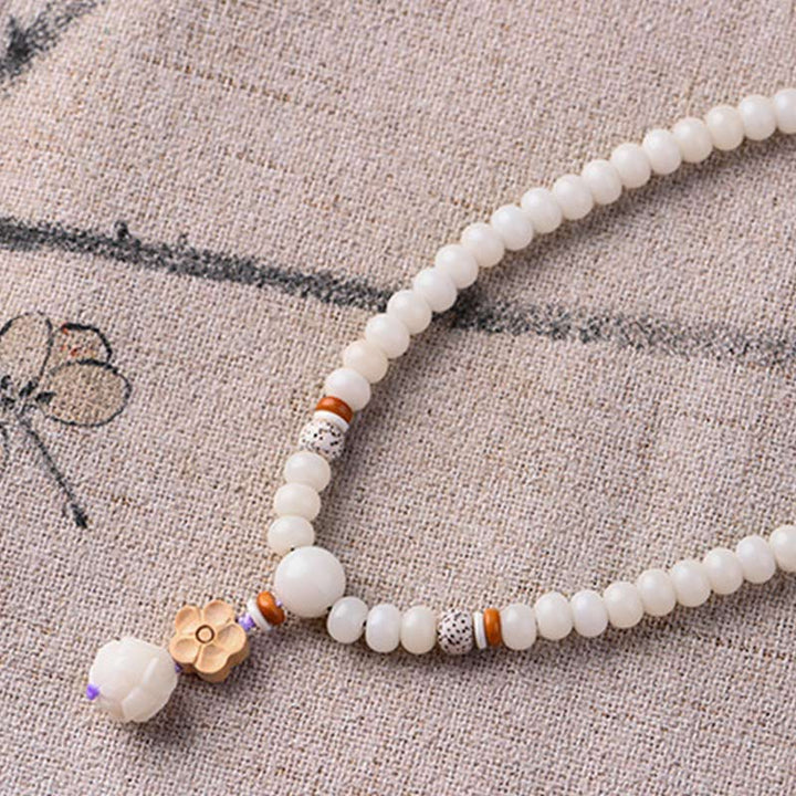 Bracelet de bénédiction Bodhi Lotus en jade blanc tibétain Buddha Stones