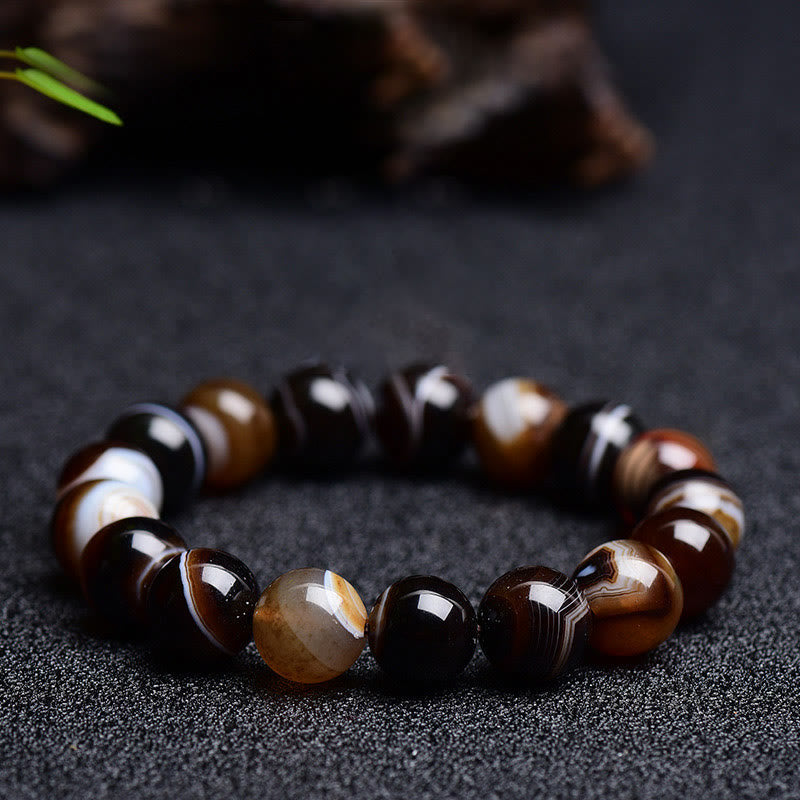 Bracelet de bonheur positif tibétain en sardonyx Buddha Stones