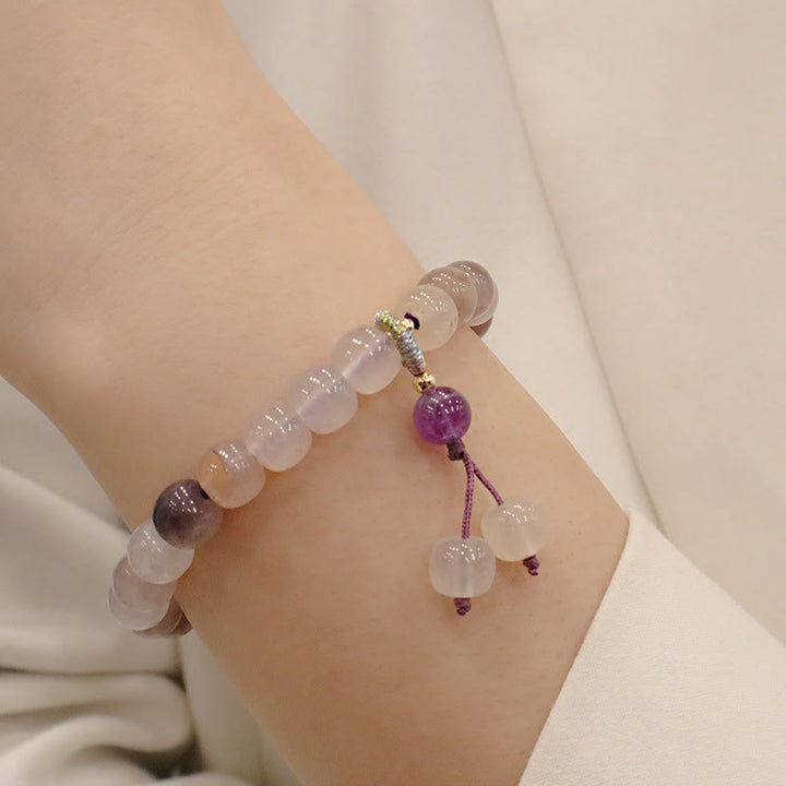 Bracelet de richesse en perles de jade violet doré en Buddha Stones