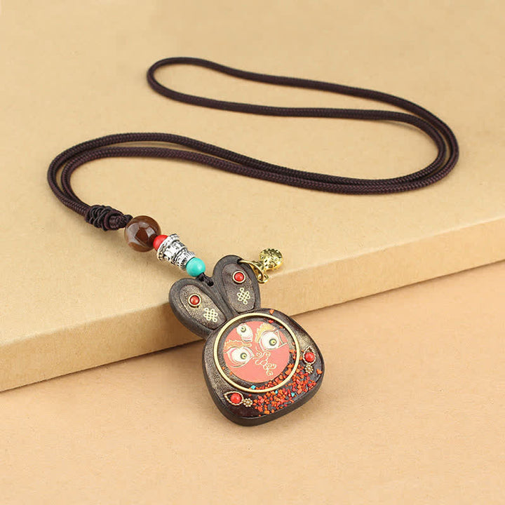 Collier pendentif Thangka en ébène du Tibet représentant les cinq dieux de la richesse