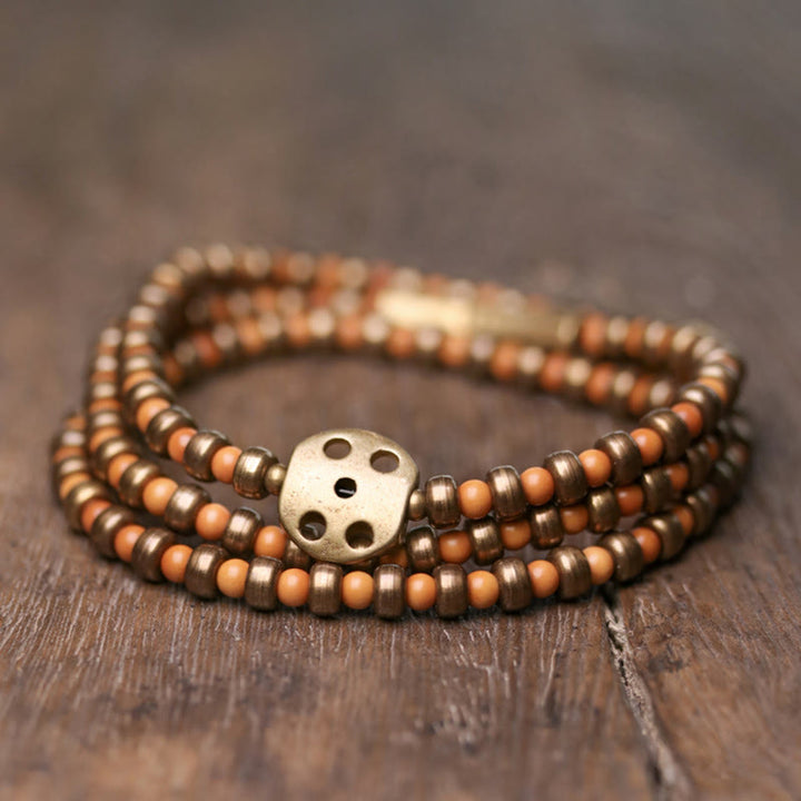 Bracelet de richesse rétro en cuivre avec noyau d'olive et Buddha Stones