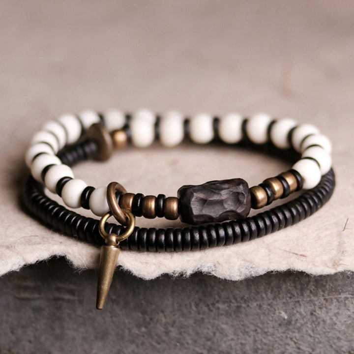 Bracelet couple force en bois d'ébène et cuivre, perles d'os et Buddha Stones
