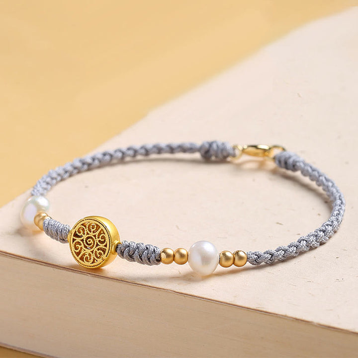 Bracelet tressé en corde bleue avec perles et arbre de fortune en cuivre et Buddha Stones