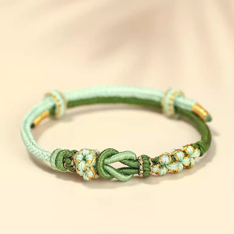Bracelet de protection porte-bonheur fait main en Buddha Stones avec nœud en fleur de pêcher à huit fils