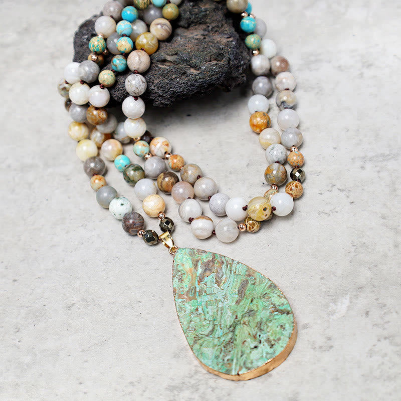 Collier de guérison en perles de jaspe Picasso naturel de l'océan Buddha Stones