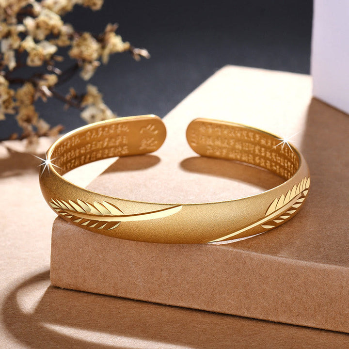 Bracelet manchette en cuivre avec Buddha Stones et plumes et cœur gravé