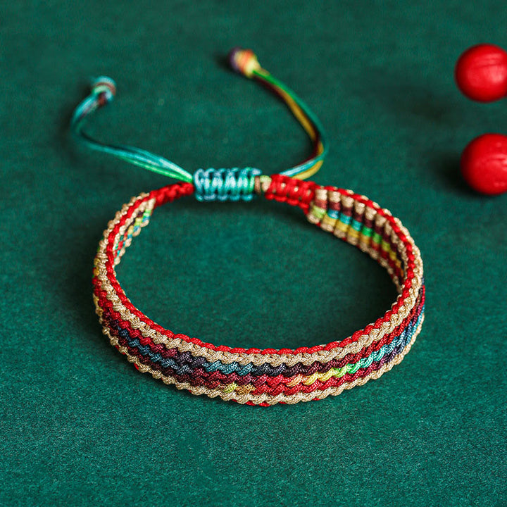 Bracelet tressé de protection multicolore arc-en-ciel fait main en Buddha Stones tibétaines