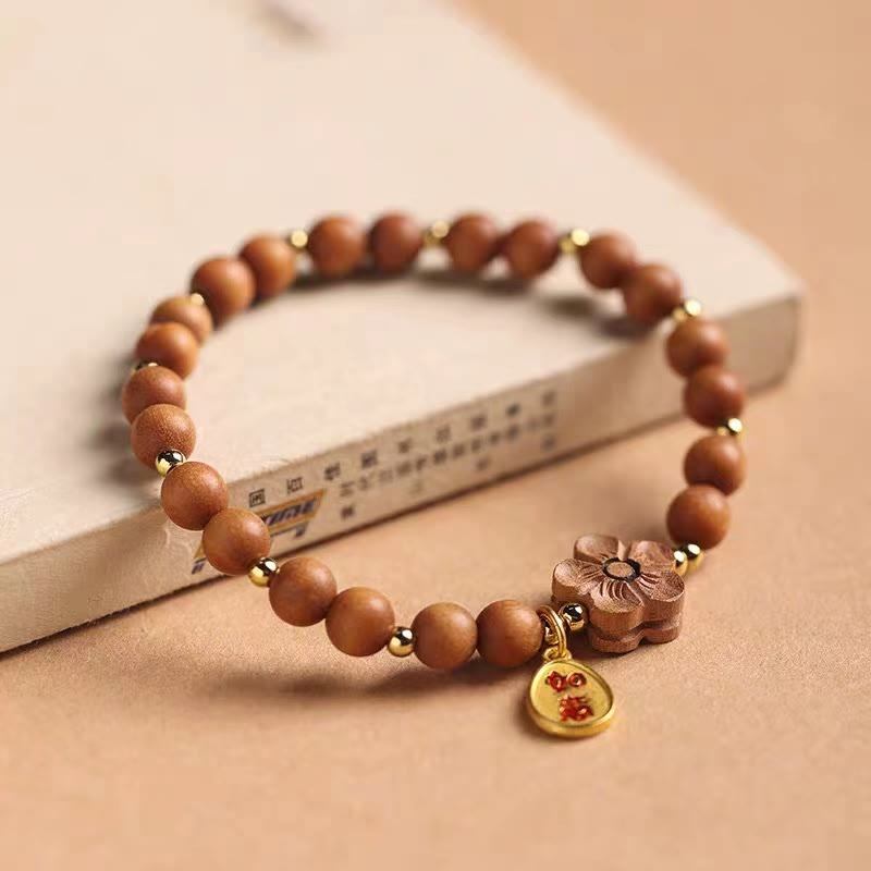 Bracelet de protection à breloques Ruyi en bois de Buddha Stones naturel et fleur de pêcher à petites feuilles en bois de santal rouge