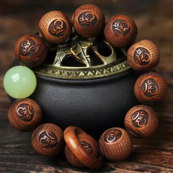 Bracelet de protection du tigre gravé en bois de rose tibétain Buddha Stones