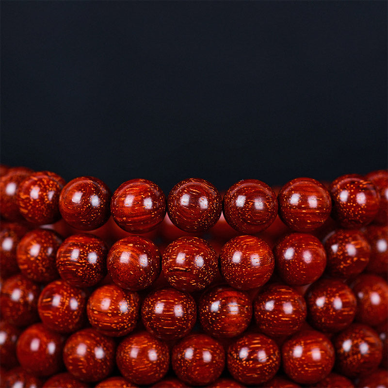Bracelet d'équilibre tibétain en petites feuilles de santal rouge avec Buddha Stones