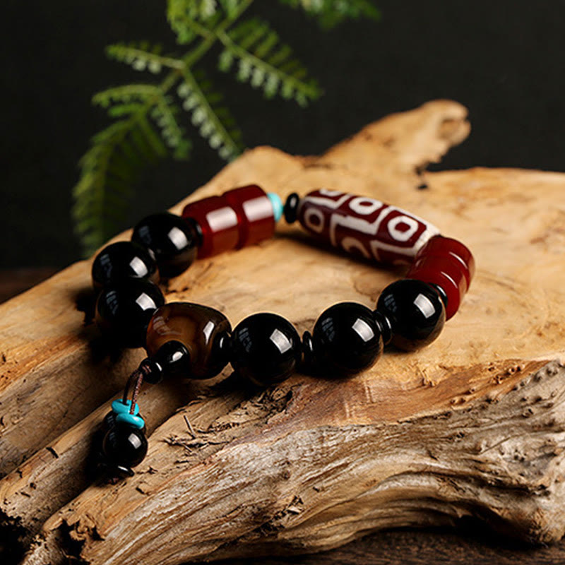 Bracelet tibétain de protection de richesse en onyx noir avec perles dzi à neuf yeux