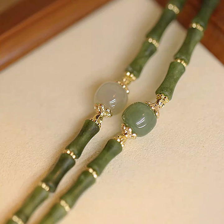 Bracelet porte-bonheur en jade Hetian péridot plaqué cuivre 14 carats avec Buddha Stones et motif bambou