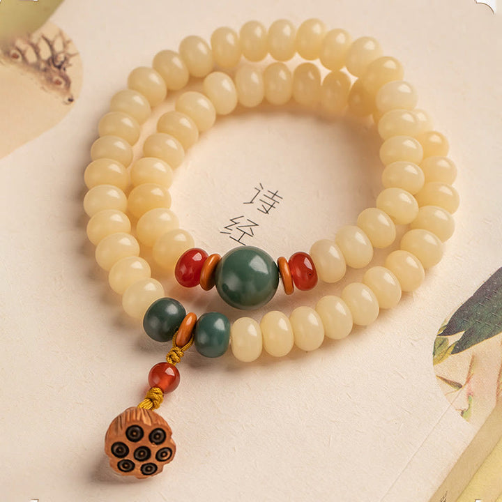 Bracelet double tour avec breloque en forme de gousse de lotus et graines de Bodhi et Buddha Stones