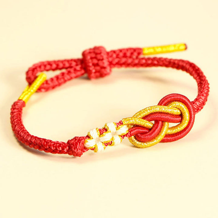 Bracelet de connexion porte-bonheur en forme de nœud de paix à huit fils fabriqué à la main par Buddha Stones