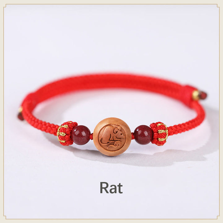 Bracelet de richesse en bois de pêche naturel Buddha Stones et caractère Fu du zodiaque chinois sculpté en cinabre
