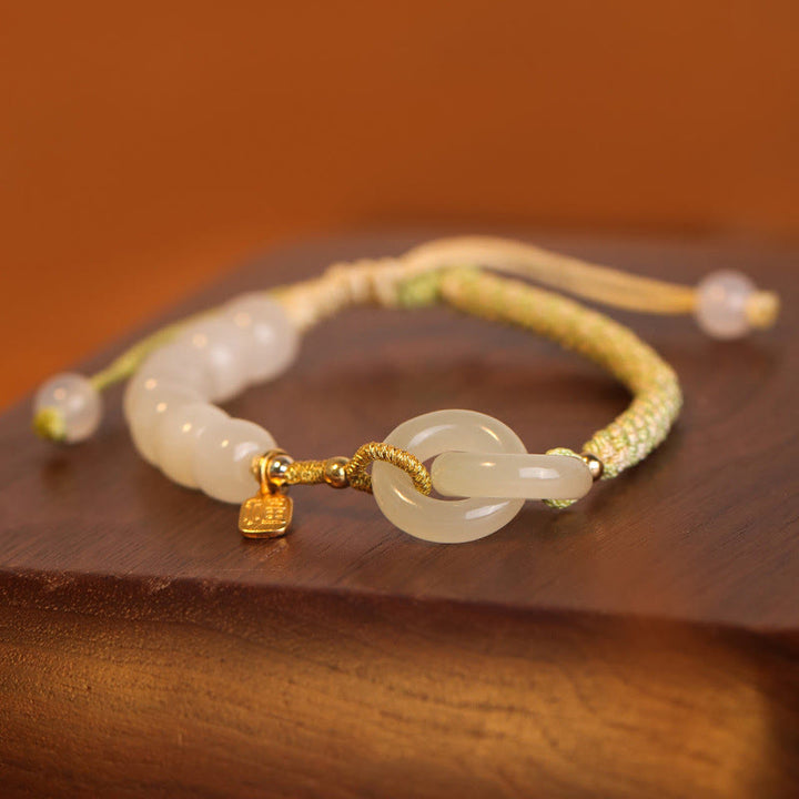Bracelet tressé en perles de jade Hetian naturelles de Buddha Stones avec boucle de paix double et caractère Fu