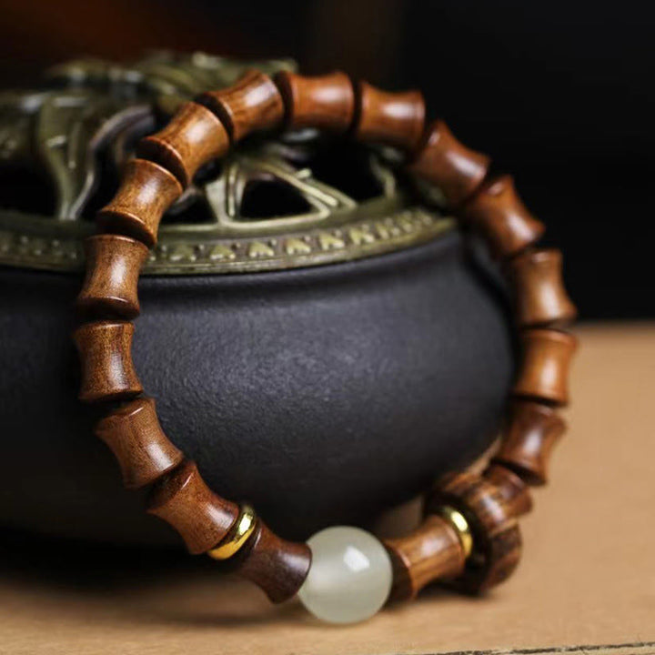 Bracelet de paix en bambou et bois de santal vert et ébène avec Buddha Stones