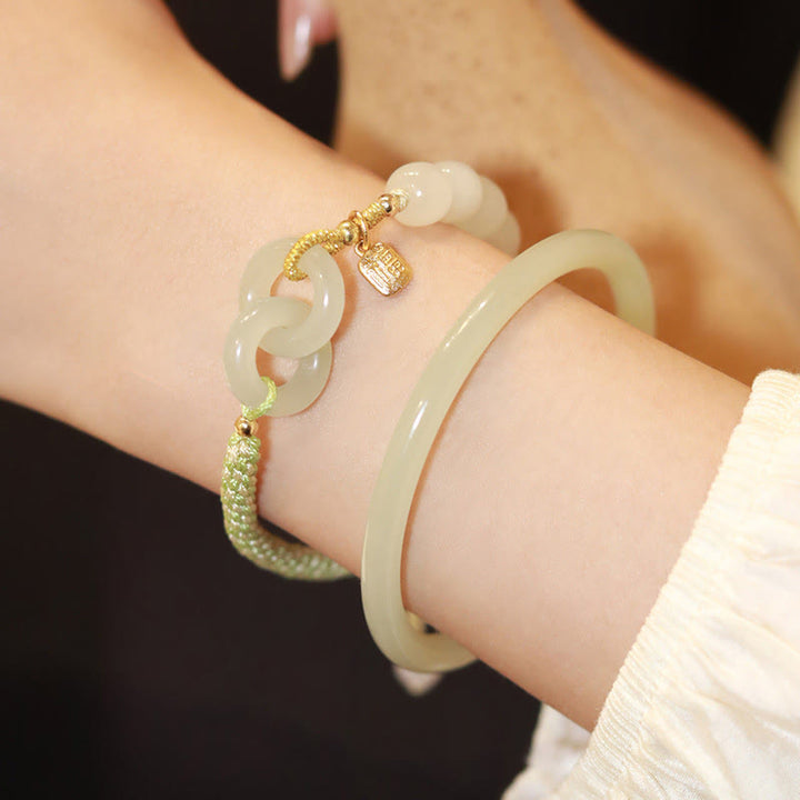 Bracelet tressé en perles de jade Hetian naturelles de Buddha Stones avec boucle de paix double et caractère Fu
