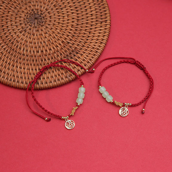 Bracelet porte-bonheur en corde rouge avec perles de jade fabriquées à la main par Buddha Stones