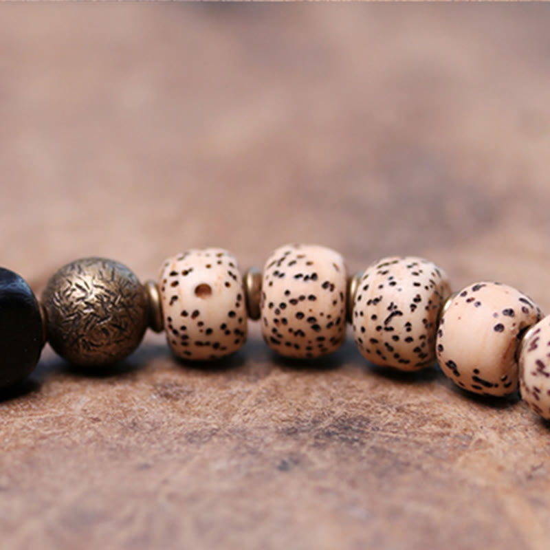 Bracelet de paix en cuivre et bois d'ébène avec Buddha Stones et graines de Bodhi tibétaines