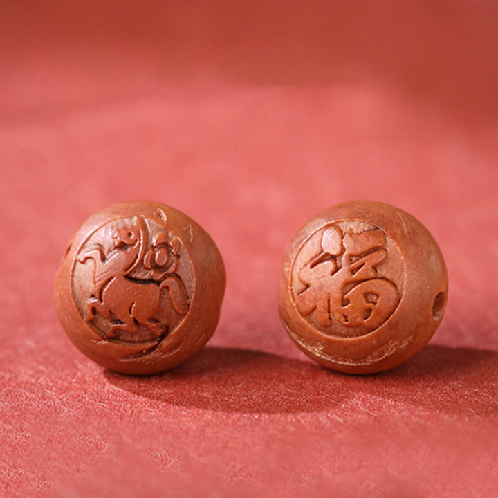 Bracelet de richesse en bois de pêche naturel Buddha Stones et caractère Fu du zodiaque chinois sculpté en cinabre