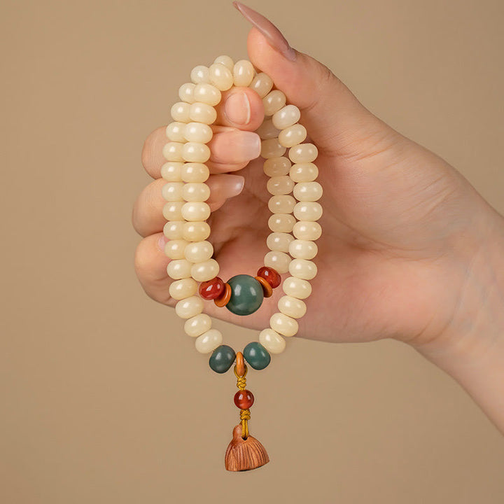Bracelet double tour avec breloque en forme de gousse de lotus et graines de Bodhi et Buddha Stones