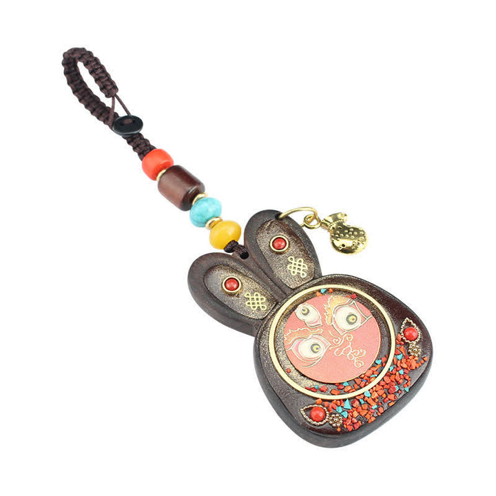 Porte-clés Thangka en ébène du Tibet représentant les cinq dieux de la richesse