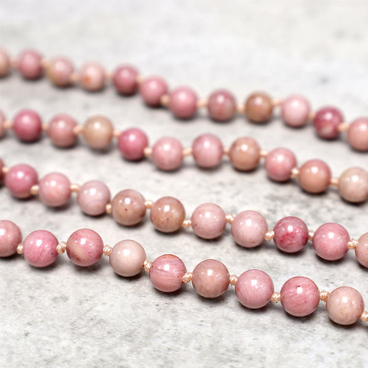 Bracelet de prière de méditation et de yoga en perles de rhodonite de 108 Mala Buddha Stones